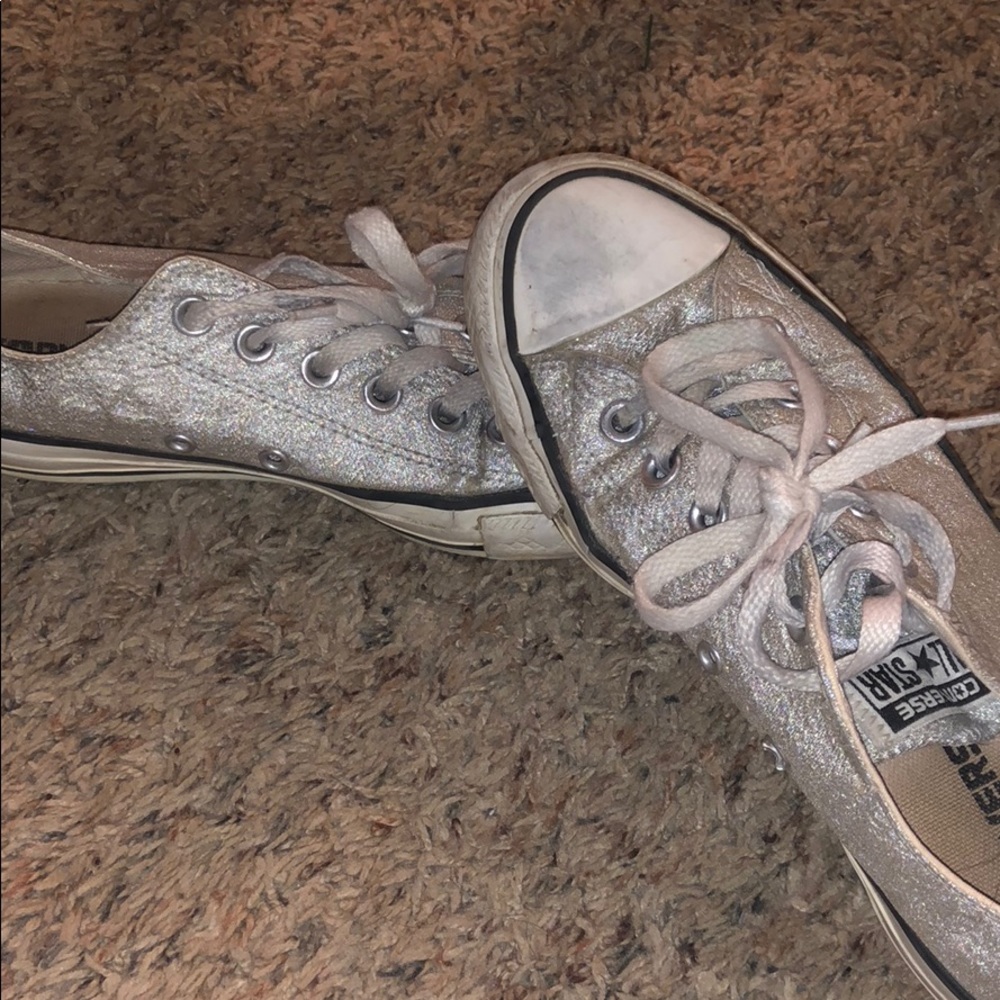 Silver Converse, very worn. Size 7